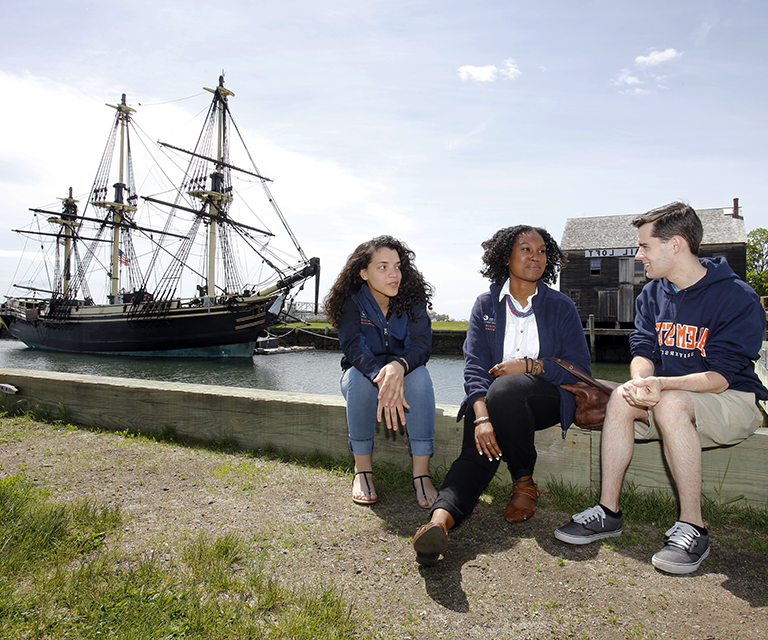 Students in front of FRIENDSHIP in Salem Harbor