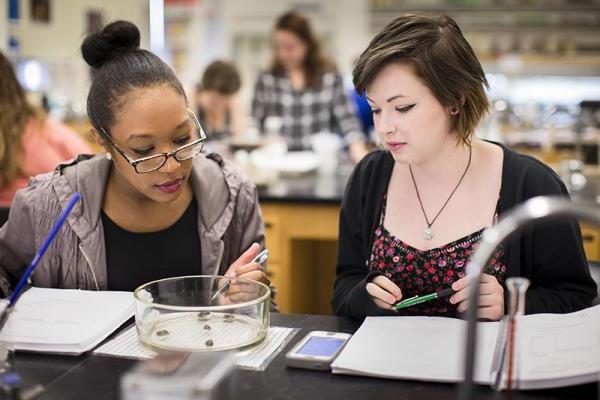 Two female students in a biology lab 